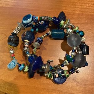 Four beaded bracelets.